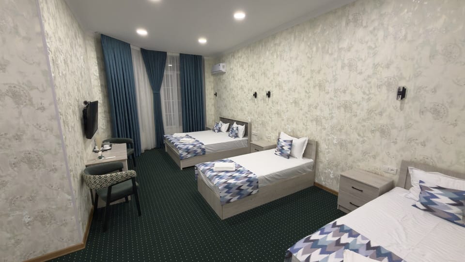 Standard Triple Room | In-room safe, desk, laptop workspace, iron/ironing board (on request)