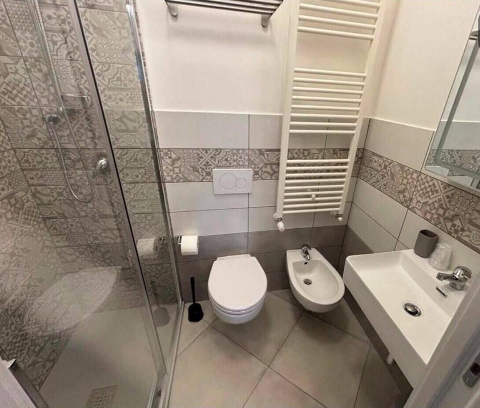 Triple Room | Bathroom | Shower, hair dryer, towels, soap