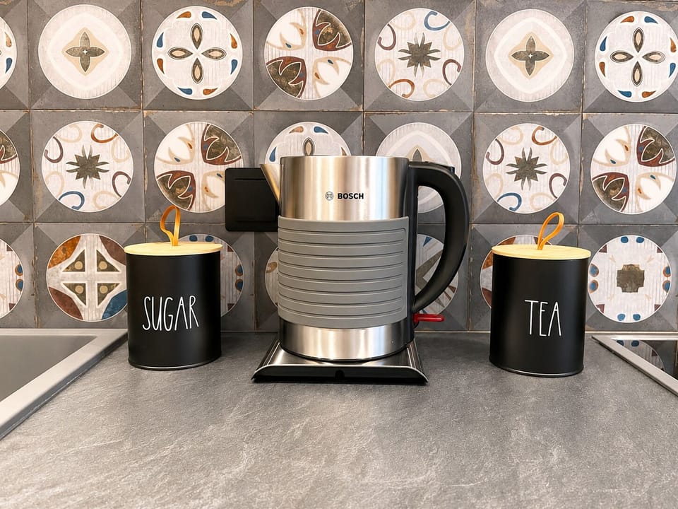 Deluxe Apartment | Private kitchen | Espresso maker, coffee/tea maker, full-size fridge, oven