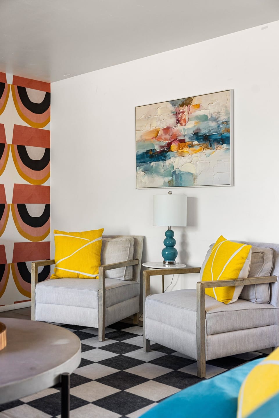 Sip your morning coffee or unwind with a good book in this inviting sitting area, complete with comfortable chairs and stylish modern décor.