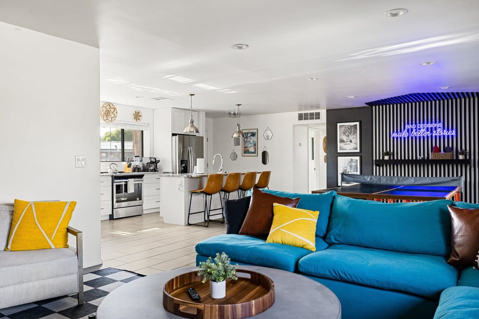 The open-concept great room connects the kitchen, dining, and game areas, creating the perfect place to relax, entertain, and spend time together with family and friends.