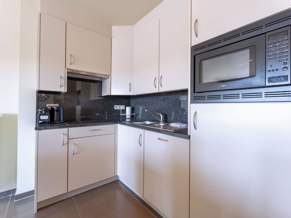 Countertop, Interior Design, Kitchen, Flooring, Cabinetry, Major Appliance, Floor, Kitchen Appliance, Room, Sink