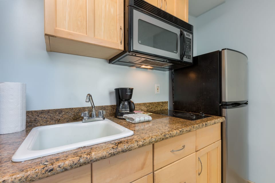 Your kitchenette has everything you need to brew morning coffee or prepare quick bites, with a microwave, fridge, and sink all within easy reach.