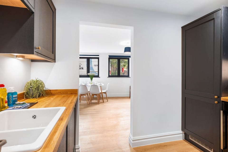 Contemporary kitchen with modern appliances and a welcoming dining space for relaxed breakfasts and evening meals.