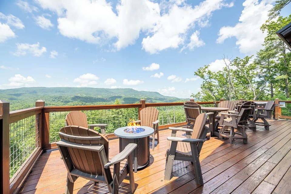 Expansive mountain views stretch across the horizon from your private deck, where Adirondack chairs and a fire table invite you to relax and soak in the fresh air.