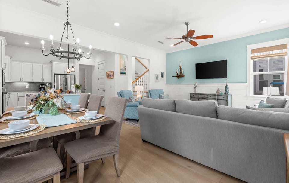 Step into your inviting open-concept living space where coastal charm meets modern comfort.