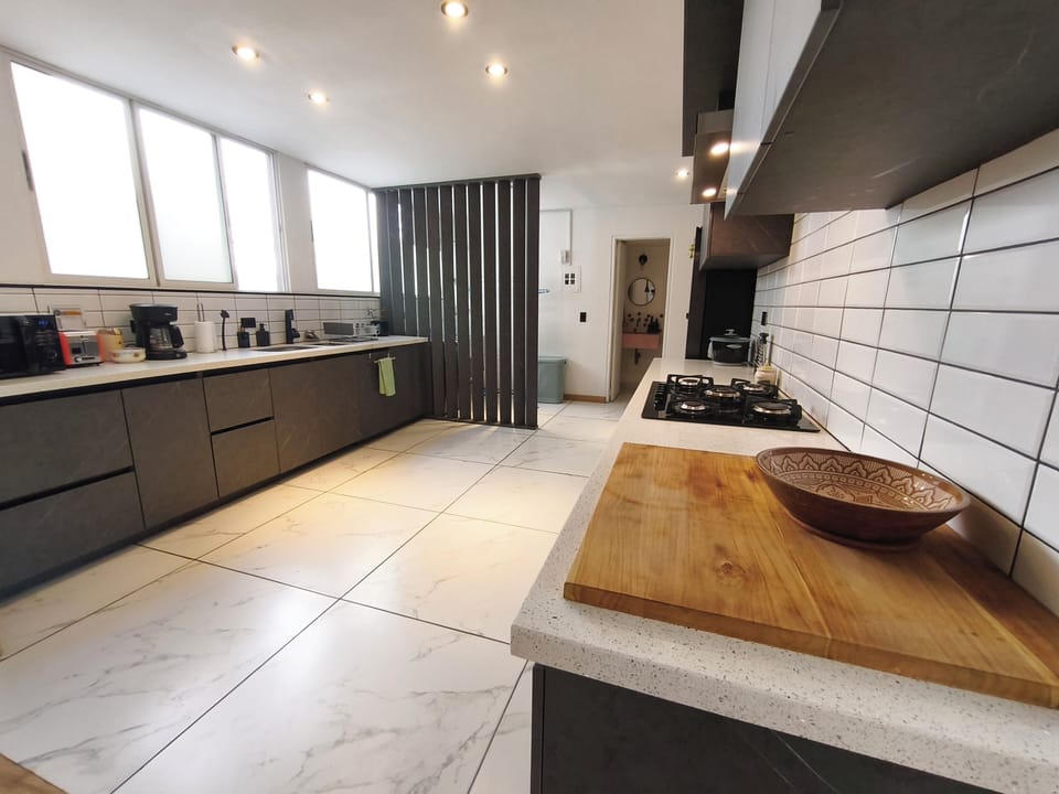 Open kitchen, coffee maker, stovetop, microwave, standard oven