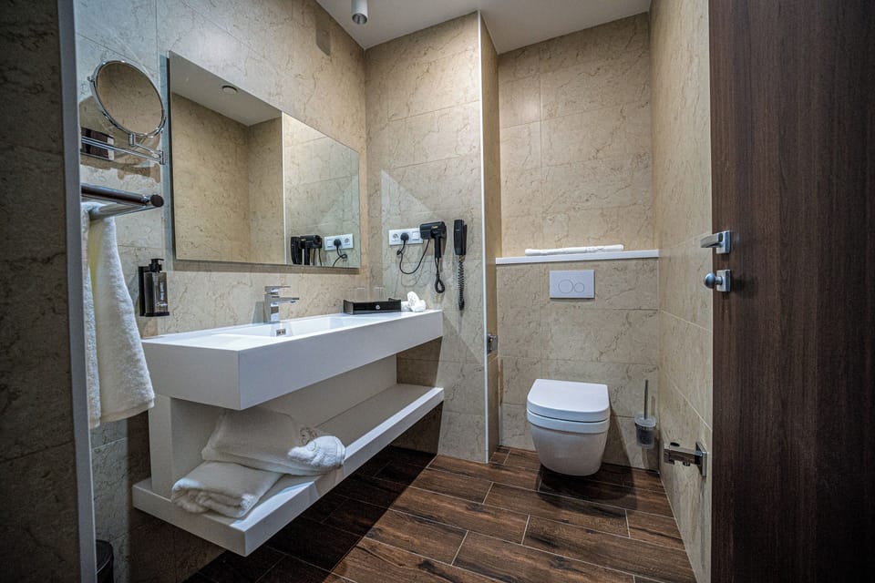 Comfort Double or Twin Room | Bathroom | Hair dryer, slippers, towels, soap