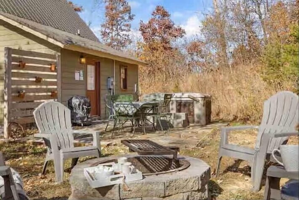 Escape into nature with a private outdoor space featuring a cozy fire pit and relaxing hot tub. Surrounded by peaceful wooded surroundings, it’s the perfect place to unwind, enjoy quiet evenings, and make lasting memories away from the everyday hustl