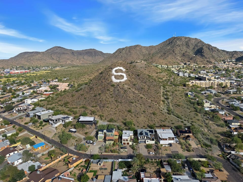 Iconic “S” mountain views, steps to trails and city conveniences.
