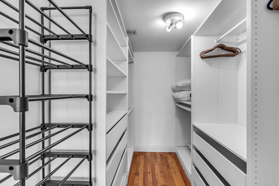 The second balcony suite offers two queen beds, a smart TV, & an ensuite​