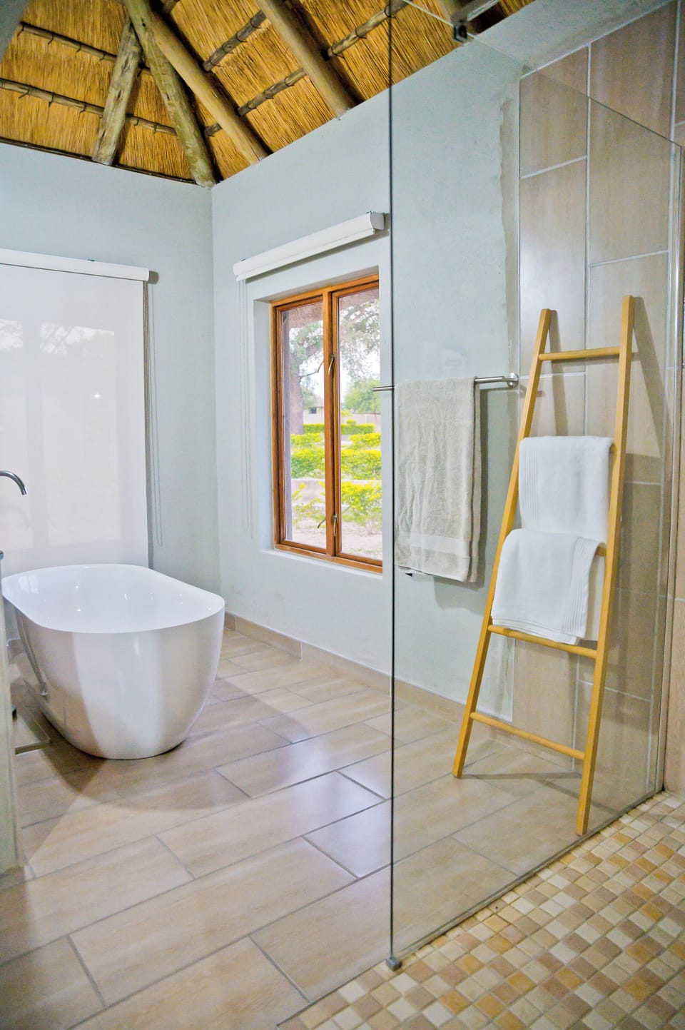 Luxury Suite, Patio, Garden View | Bathroom | Separate tub and shower, towels, soap, shampoo