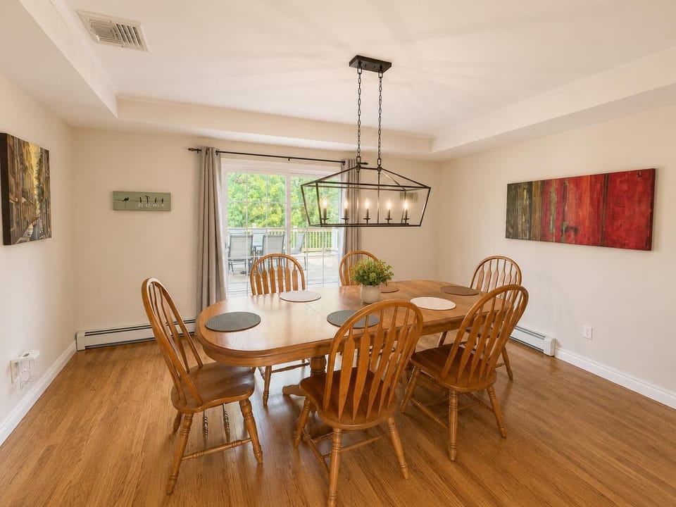 Large dining room that looks out onto the deck