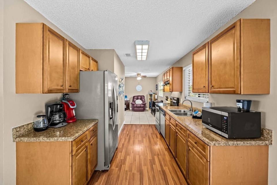 Kitchen | Coffee Station & Stainless Steel Appliances | Open Layout Connection