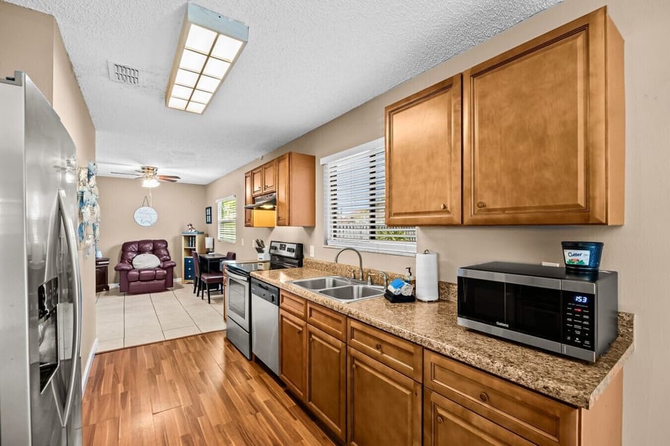 Kitchen | Electric Range & Stainless Steel Refrigerator | Workspace Setup