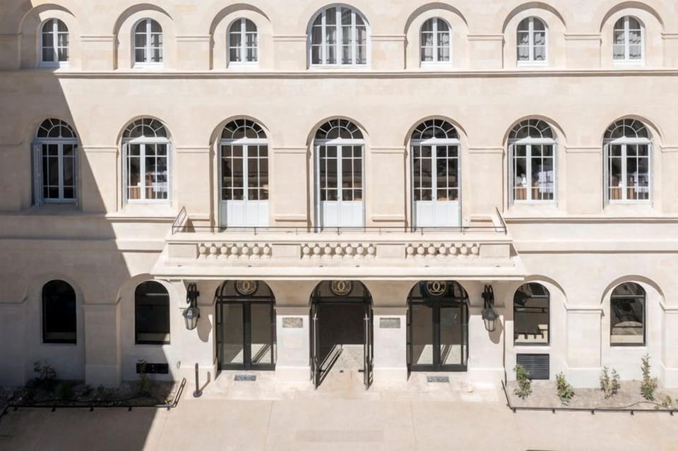 The elegant exterior of Le Grand Hôtel Dieu, where classical French architecture and a prestigious five-star address meet.<br>