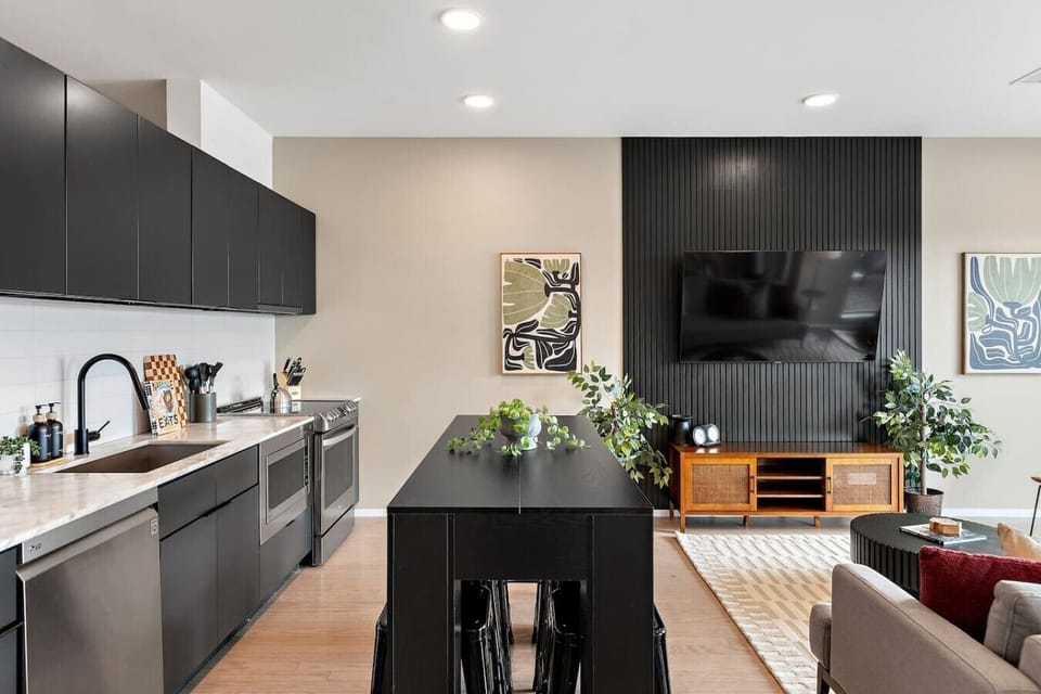 Fully equipped, modern-appliance kitchen for all of your cooking needs! Coffee machine + coffee provided. Seating for 8 at the high-top table, and seating for 4 at the dining table.