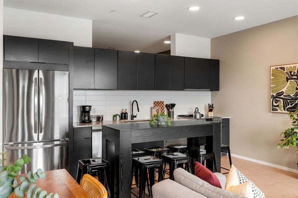 Fully equipped, modern-appliance kitchen for all of your cooking needs! Coffee machine + coffee provided. Seating for 8 at the high-top table, and seating for 4 at the dining table.