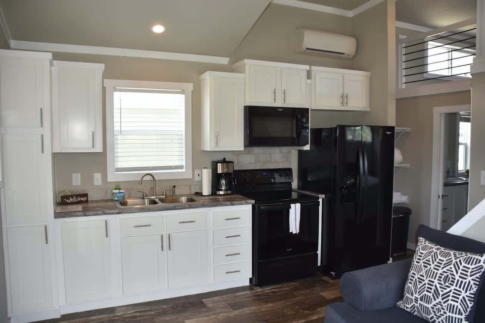 Full-size fridge, microwave, coffee maker, and stocked cookware. Skip the restaurant lines