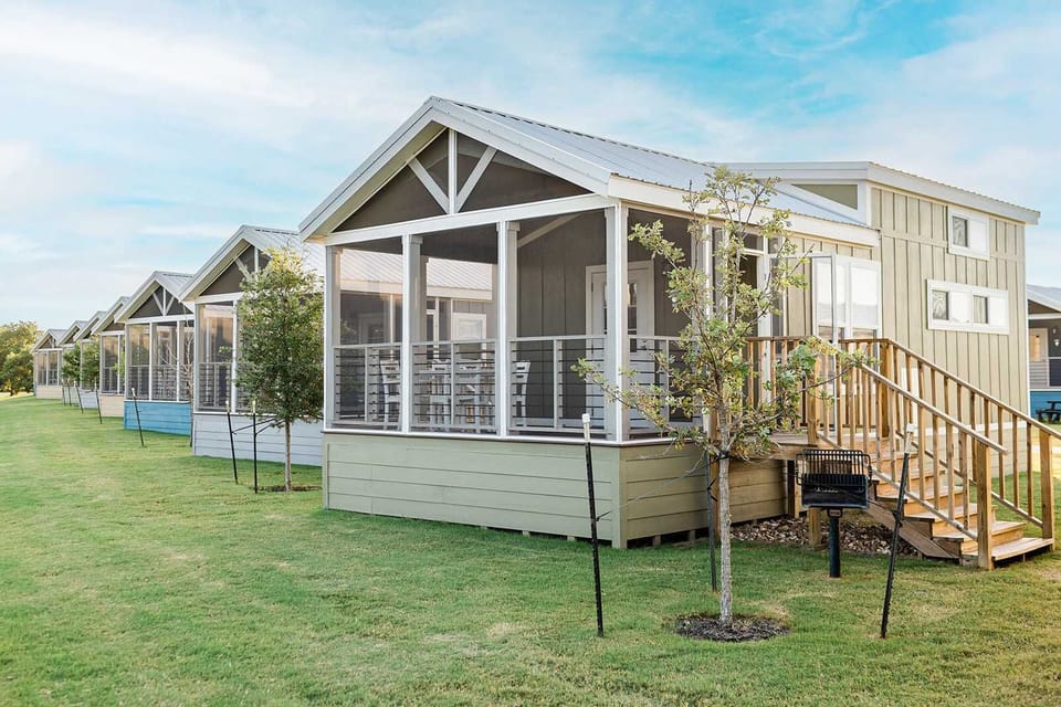 Welcome to your cottage. Screened porch, private grill, and a front-row seat to slower living