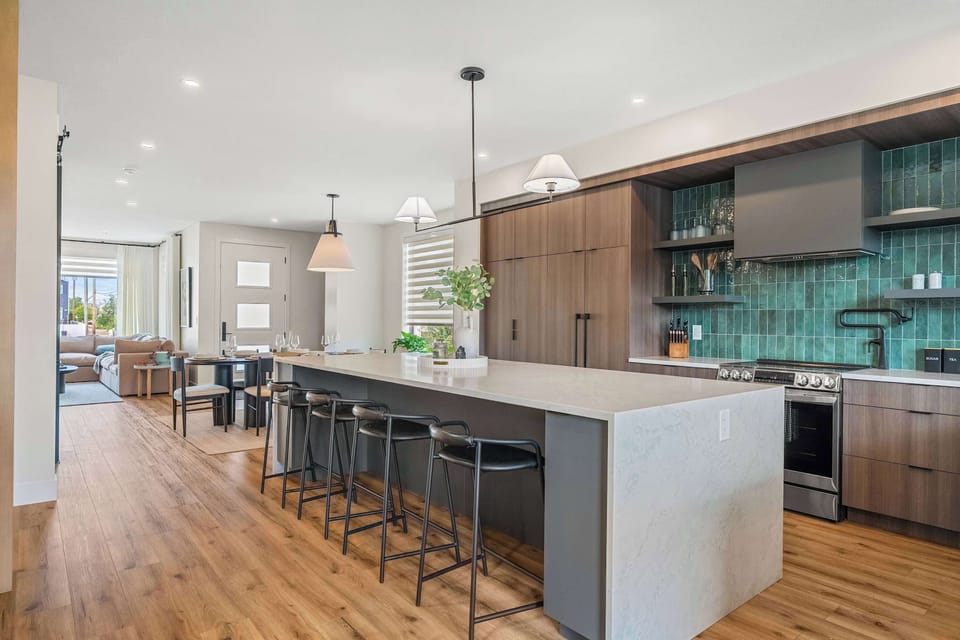 Modern kitchen with green tile and high-end finishes
