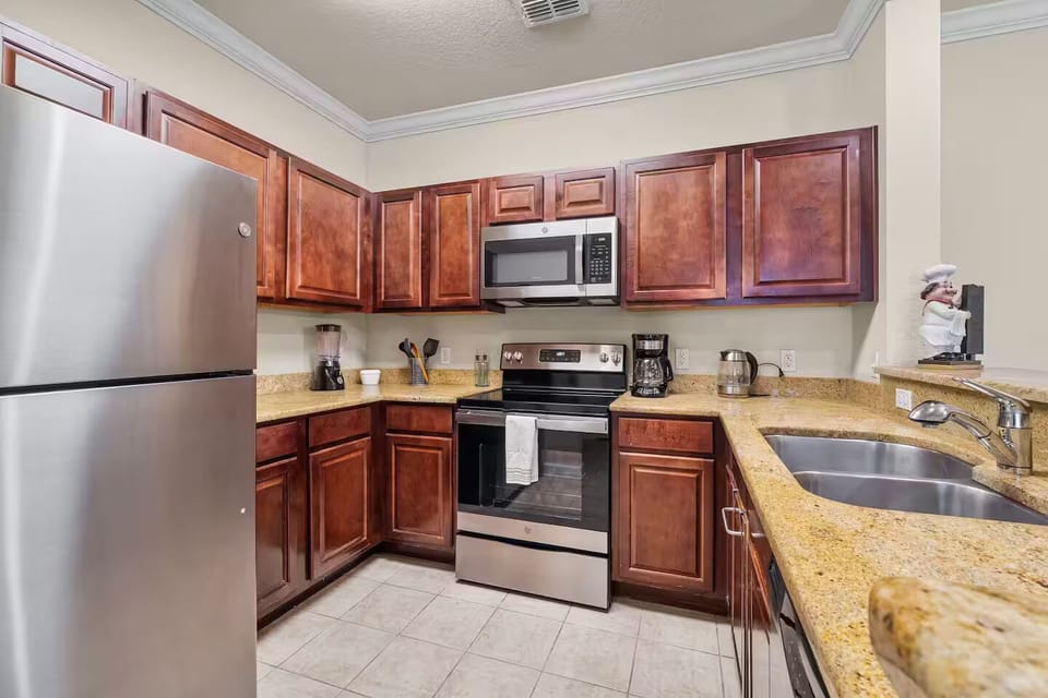 Spacious kitchen with modern appliances for easy meal prep.
