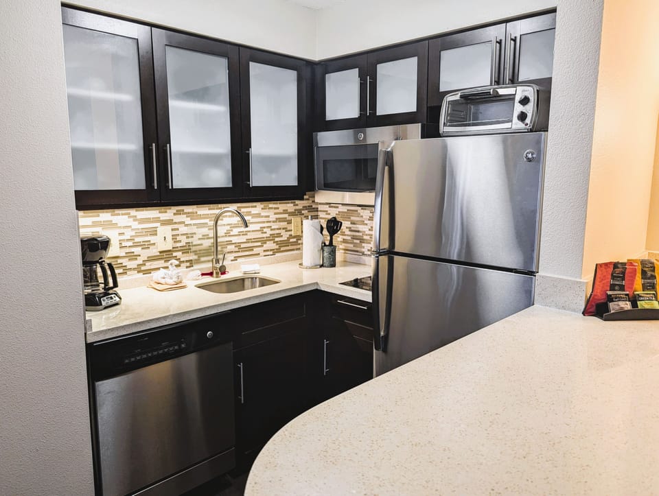 Well-appointed kitchen with contemporary cabinets and full appliances.