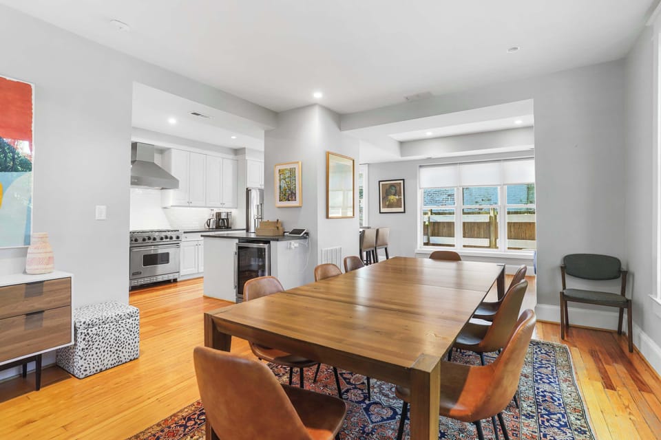 Bright dining space with natural light and seating for 8