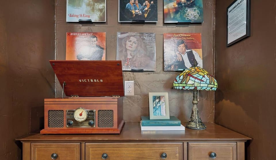 The record player is just decorative now (guests kept breaking our record player), but the bluetooth + radio function works so you can listen to radio or connect your phone to play music : )
