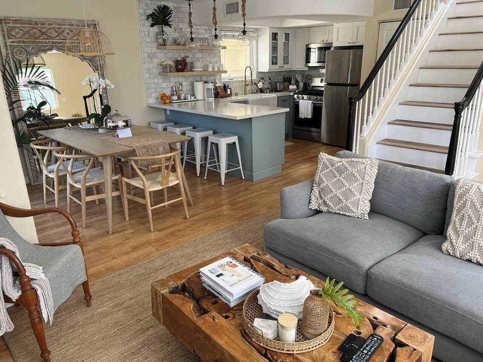View of common living room, kitchen and dining area.