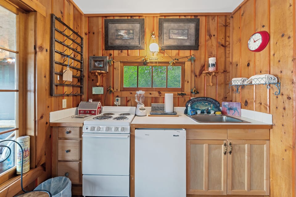 Gas stove and mini fridge. | Main Level