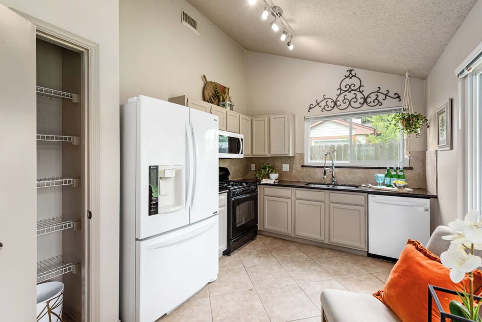 Chef-ready kitchen. Features plenty of cabinet space, a full-size refrigerator, 