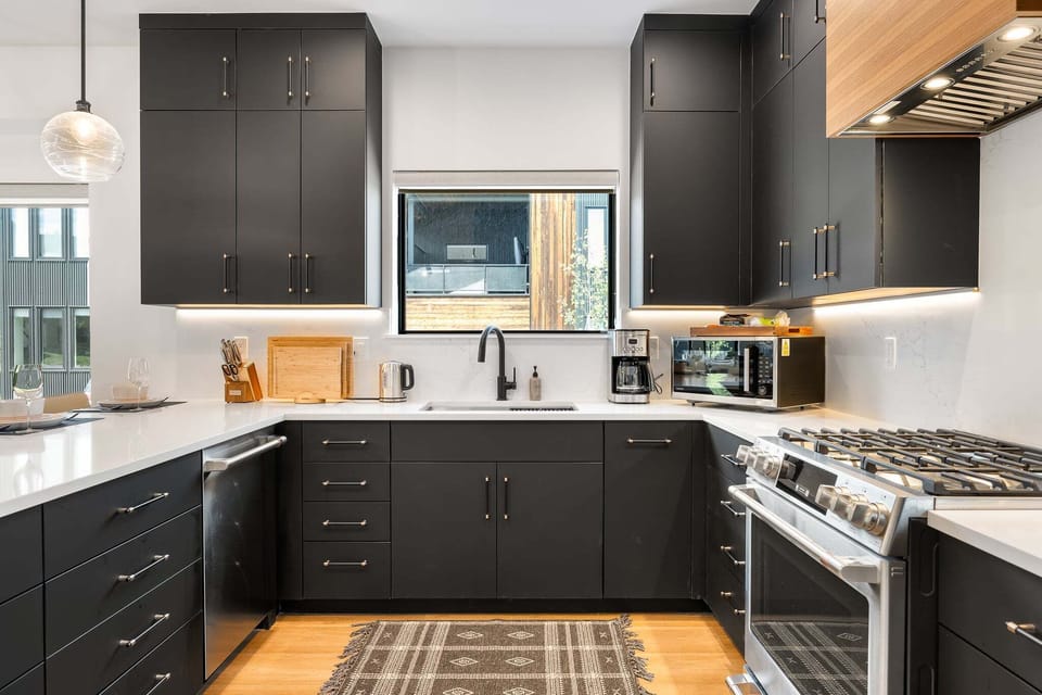 Modern, fully equipped kitchen with stainless steel appliances