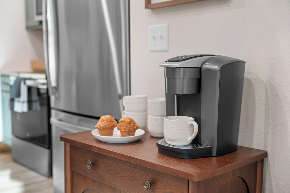 Start the day off right with a cup of coffee from the coffee bar waiting by the fridge.