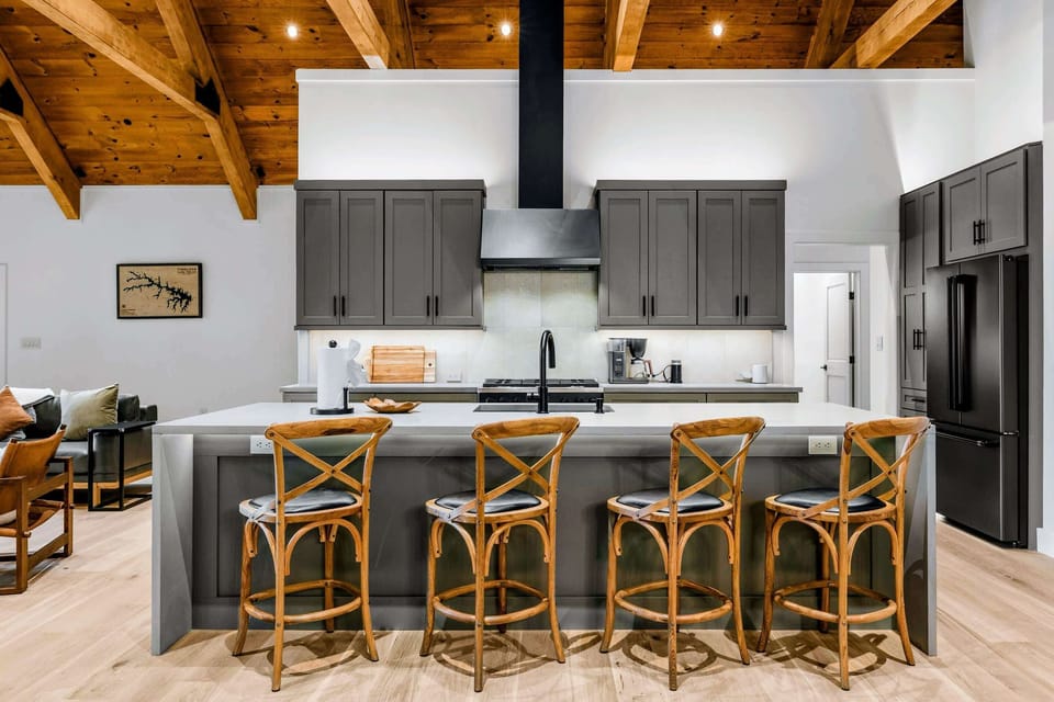 Kitchen - The island seats four while the chef works the pro-style gas range behind.