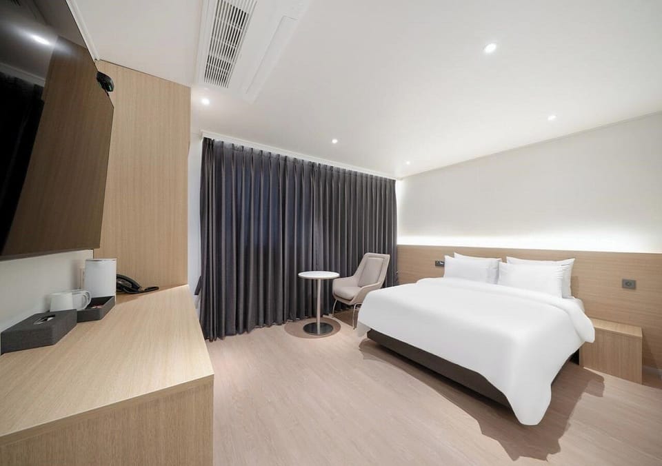 Signature Double Room | Premium bedding, desk, laptop workspace, blackout drapes