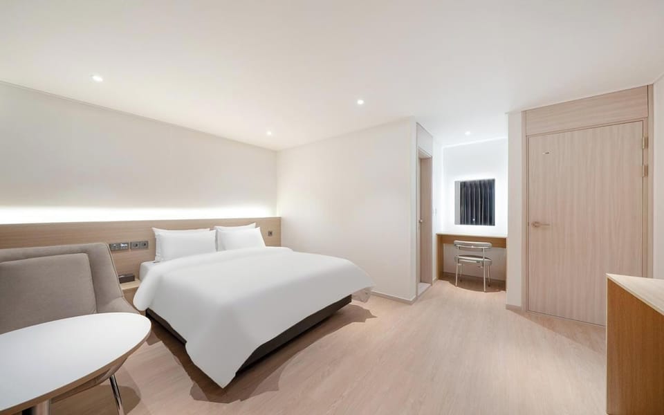 Signature Double Room | Premium bedding, desk, laptop workspace, blackout drapes