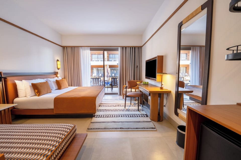 Superior Twin Room, Pool View | Minibar, in-room safe, desk, blackout drapes