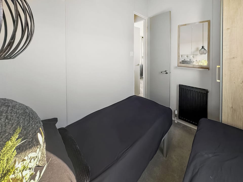 Twin bedroom | Atlas Heritage - North Wales Holidays, Towyn