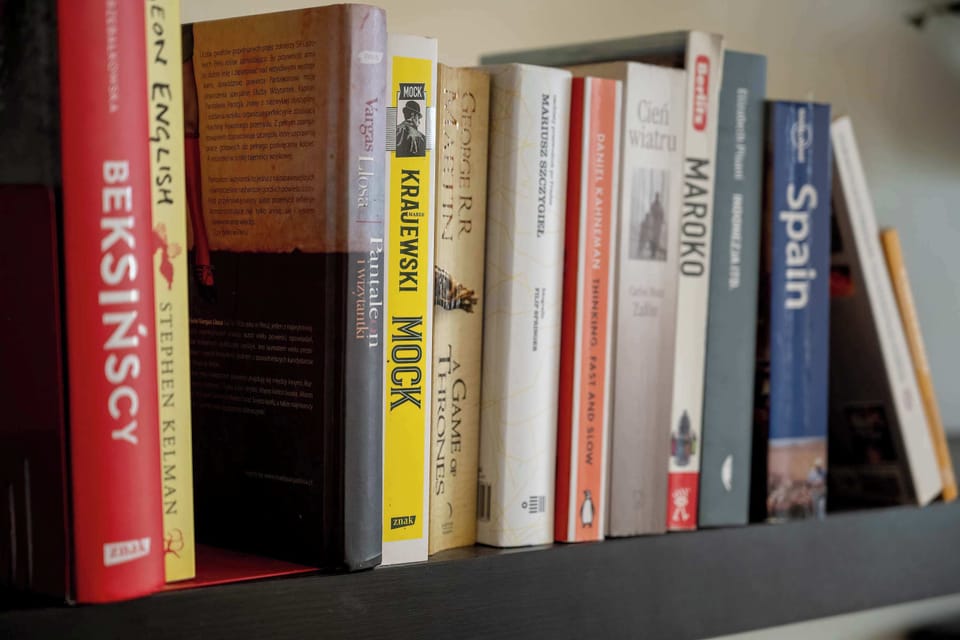Decorative bookshelf with a selection of books and stylish interior accents.