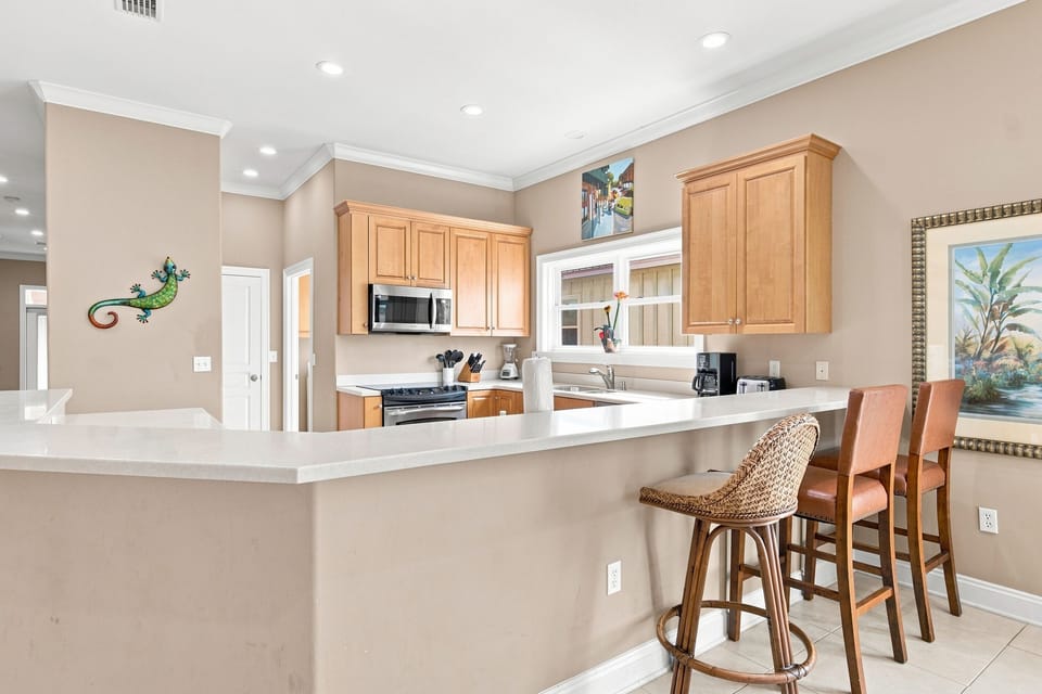 Kitchen island with bar seating, open to the dining area