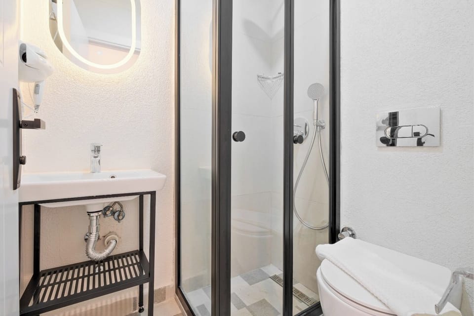 Shower, hair dryer, slippers, towels