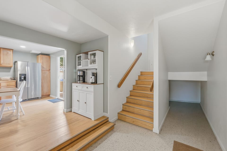 Step into a bright, open layout where clean lines and natural wood tones create a welcoming flow. Your fully-equipped kitchen seamlessly connects to comfortable living spaces, perfect for unwinding after exploring the area.