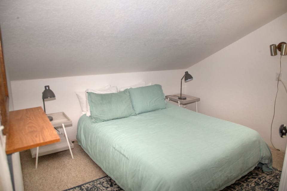 Unwind in your serene sleeping space, where soft linens and gentle lighting create a peaceful retreat after a day of adventure.