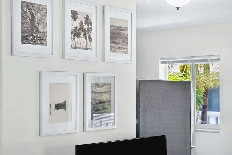 Unwind in the inviting living room with comfortable seating and a Smart TV for your entertainment.