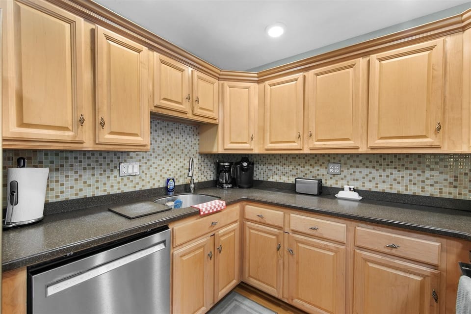 Beautiful wood cabinetry and ample counter space provide everything you need to feel right at home.