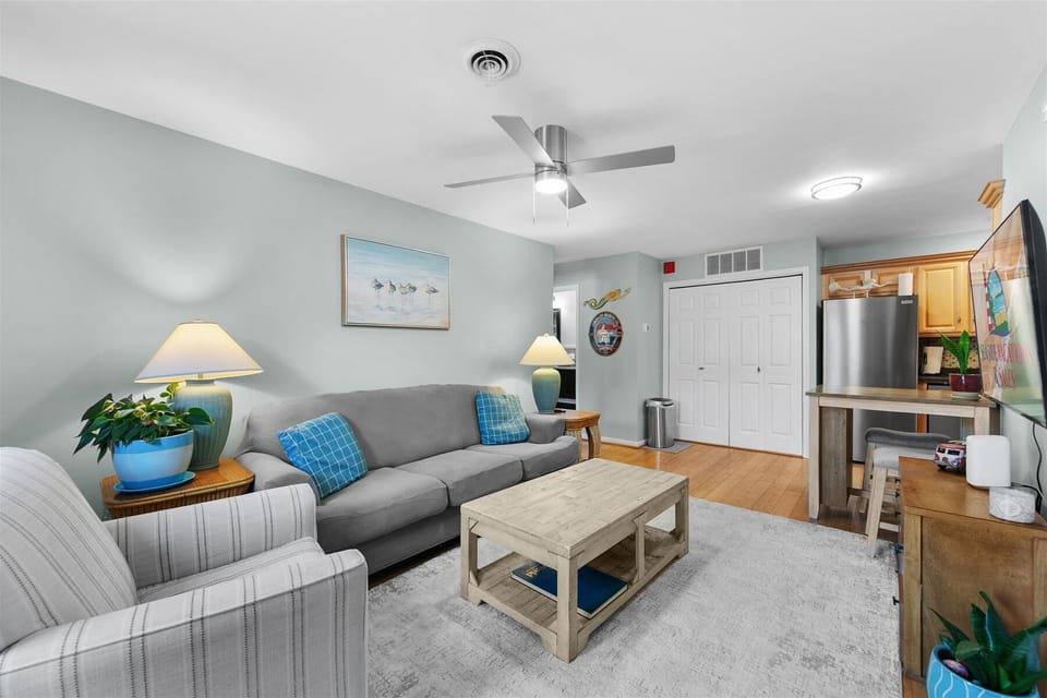 A bright and inviting living room featuring comfortable seating for the whole group.