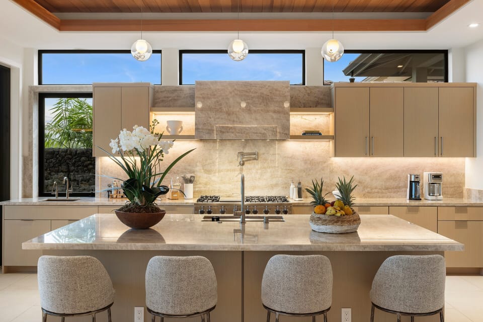 Start slow mornings around the oversized island, designed for coffee, conversation, and effortless entertaining.