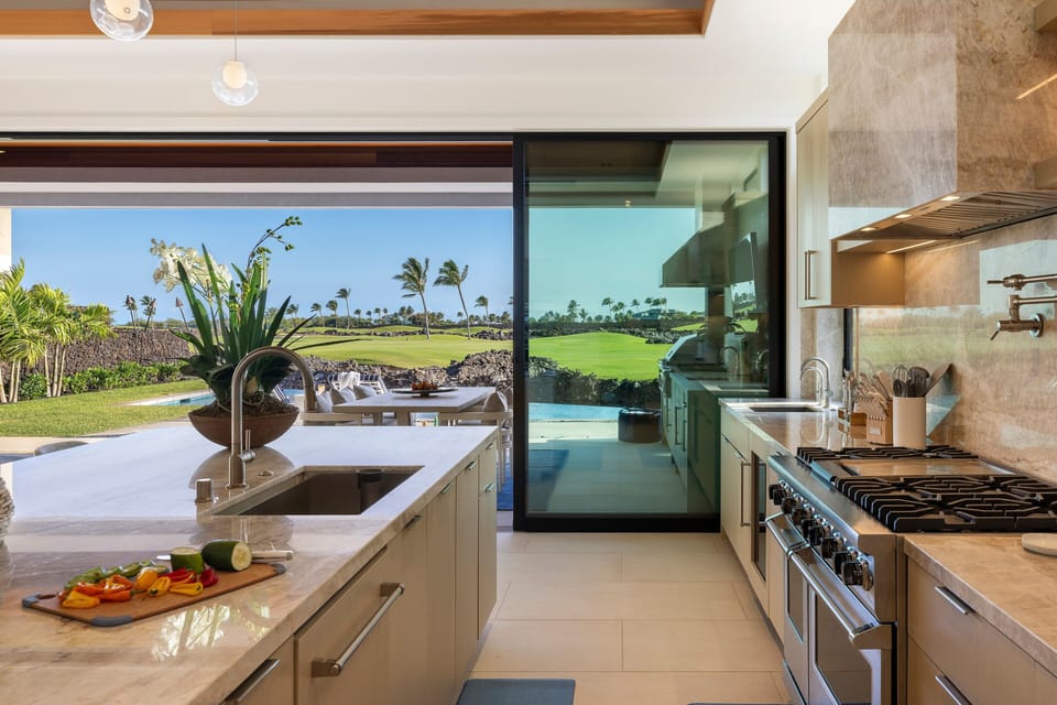 Prepare meals with the fairway just beyond the glass, bringing the beauty of the outdoors into every moment.