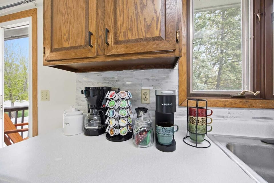 Hot beverage station, with caffeinated and non-caffeinated options.